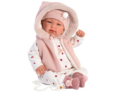 Kūdikis su pavasariniu kombinezonu vežimėlyje