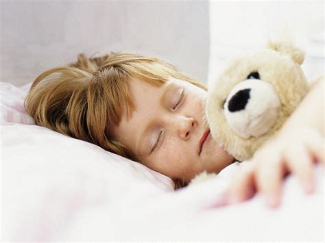 vaikas miegantis lopšyje