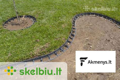 Plastikiniai borteliai, skiriantys gėlyną nuo vejos