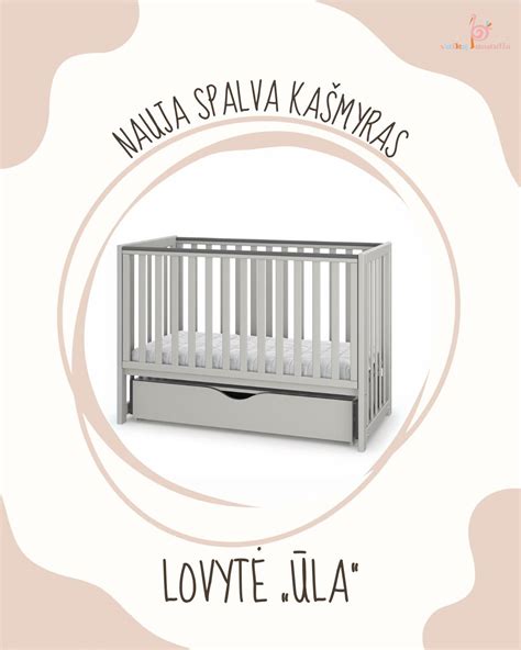 kūdikis laikosi už lovytės krašto