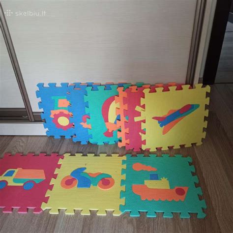 Vaikiškas kilimėlis-dėlionė, sugeriantis kritimo jėgą