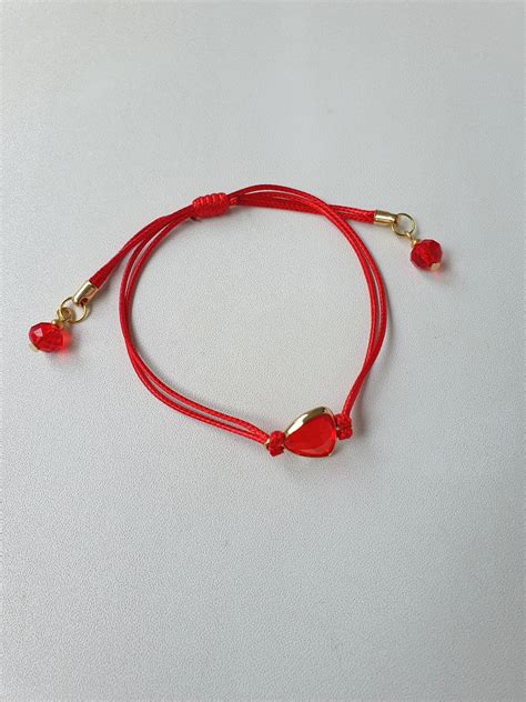 raudono siūlo apyrankės