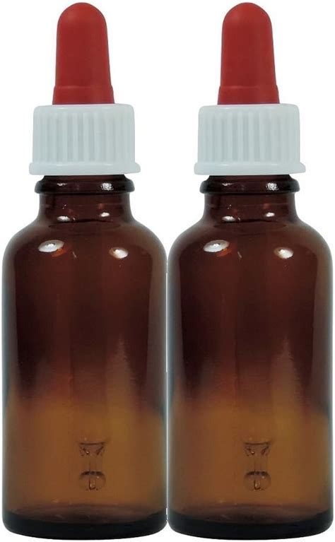 stiklinis buteliukas su sirupu ir žolelėmis