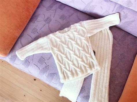 Scheminis naujagimio megztuko dalių mezgimo vaizdas