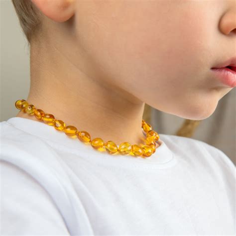 Gintariniai karoliai kūdikiams - rizika